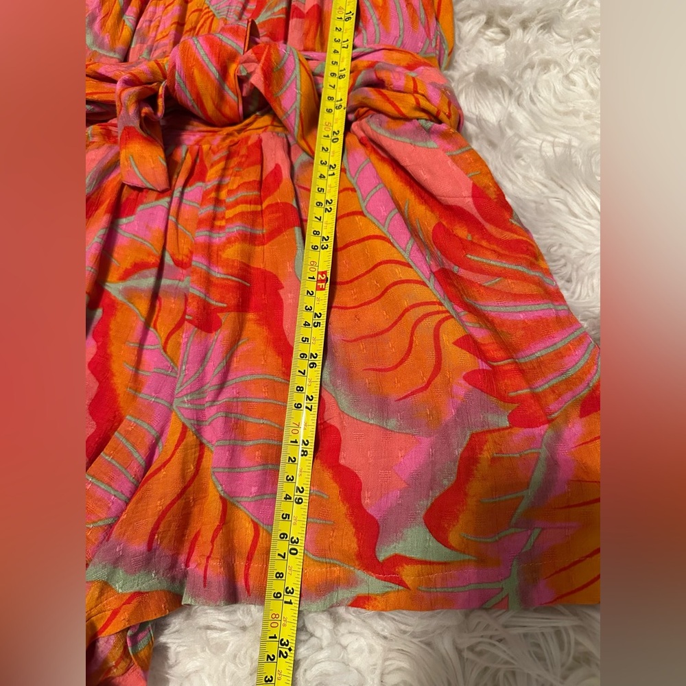 One-piece, skort with back zipper & waist-sash.  Size XS; fits like Small.